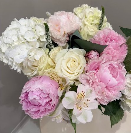 Pink peonies, garden roses, and alstroemeria arrangement